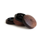 three wooden grinders sitting on top of each other