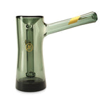 a green glass vase with a black base